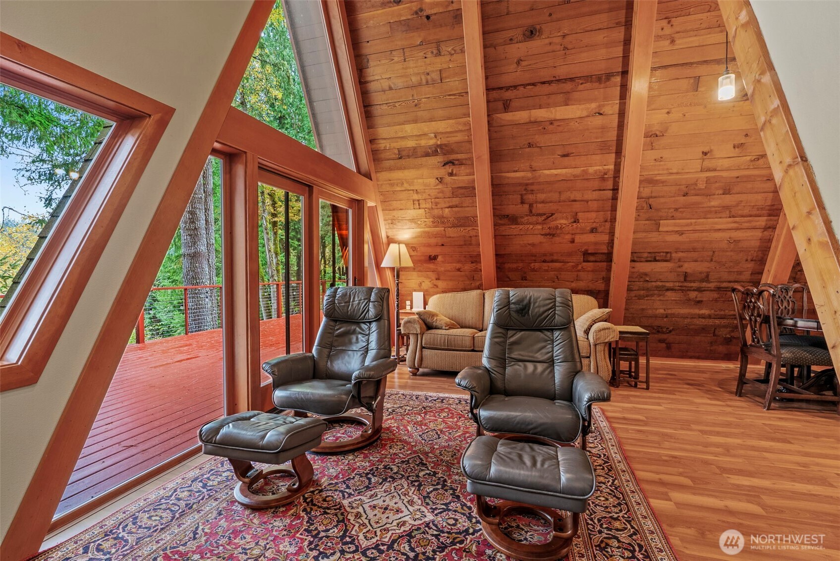 1703 Tower Road Castle Rock, WA 98611 - Photo 10 of 38 a view of a patio with chairs and a table