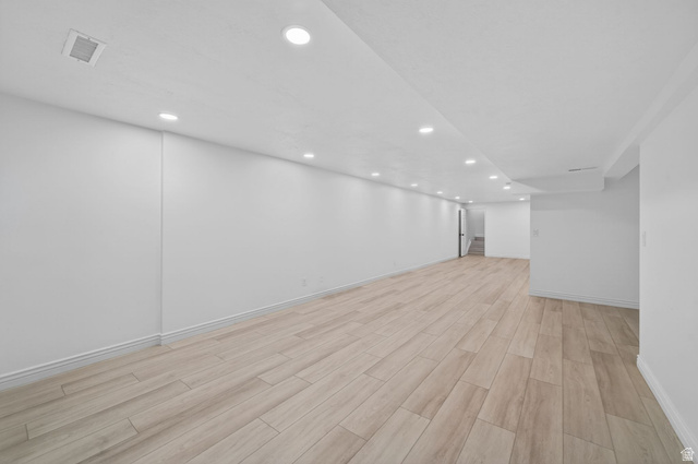 6969 South 855 East Midvale, UT 84047 - Photo 33 of 55 Spacious interior featuring light wood-finish flooring, recessed lighting, white walls, white baseboards, and a white ceiling