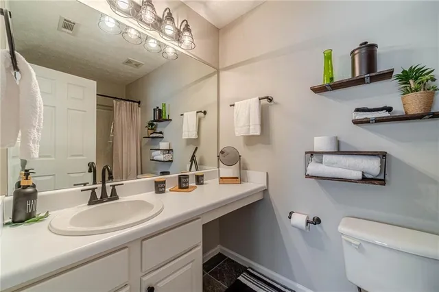 a bathroom with a sink double vanity and a mirror