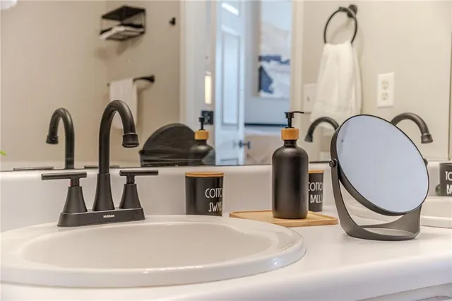 a bathroom with a double vanity sink and a bathtub