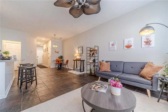 a living room with furniture and wooden floor