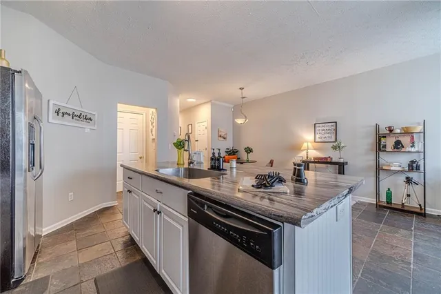 a kitchen with a sink and cabinets