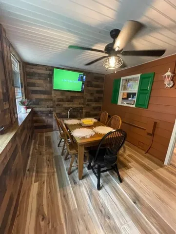 a backyard of a house with table and chairs