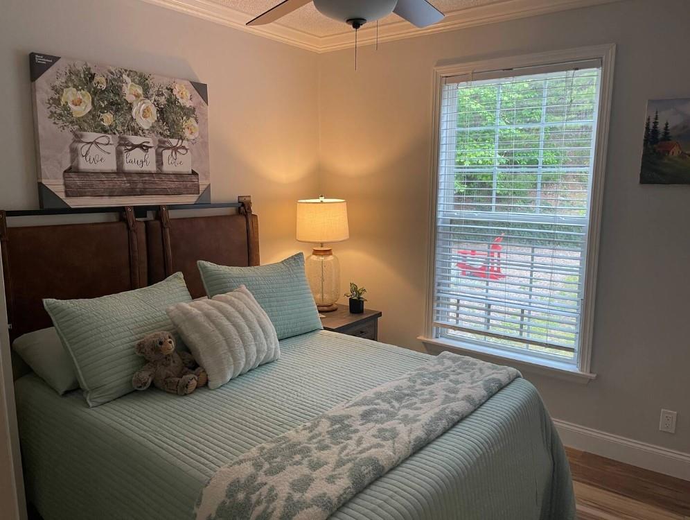 40D Kuvasz Weg, Unit B Helen, GA 30545 - Photo 6 of 12 a bedroom with a bed and a window