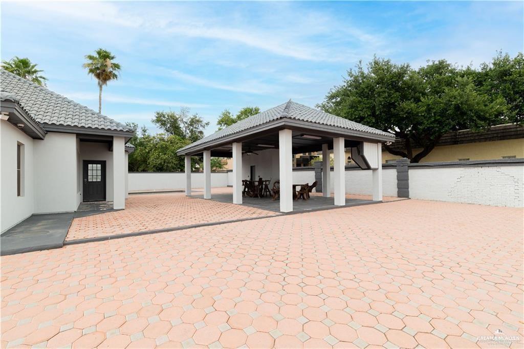 3222 South 5th Lane McAllen, TX 78503 - Photo 12 of 14 a front view of a house with a yard
