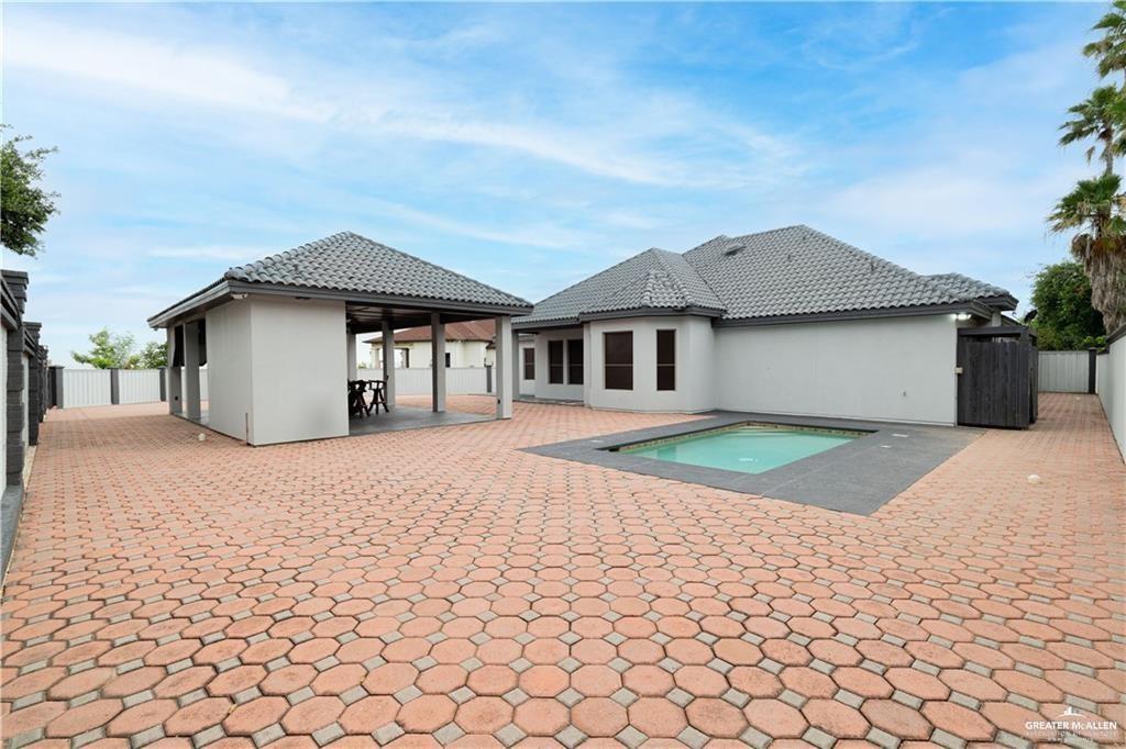 3222 South 5th Lane McAllen, TX 78503 - Photo 13 of 14 a white house with a large tree in front of it