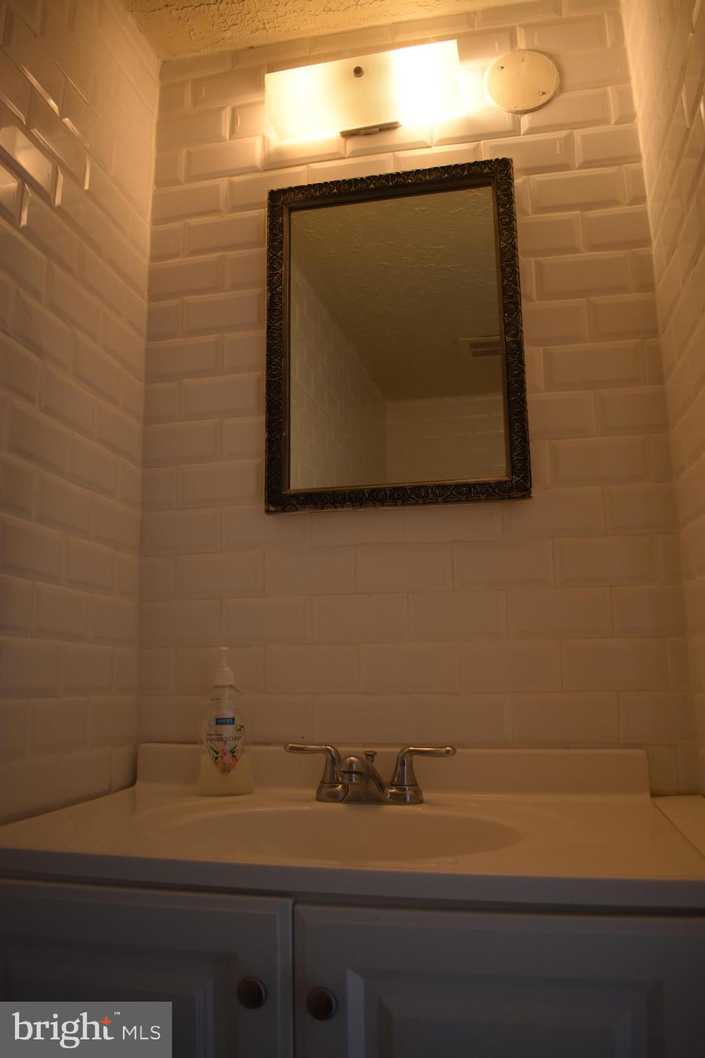 583 Summit Hall Road Gaithersburg, MD 20877 - Photo 13 of 52 Convenient 1/2 bathroom on main level