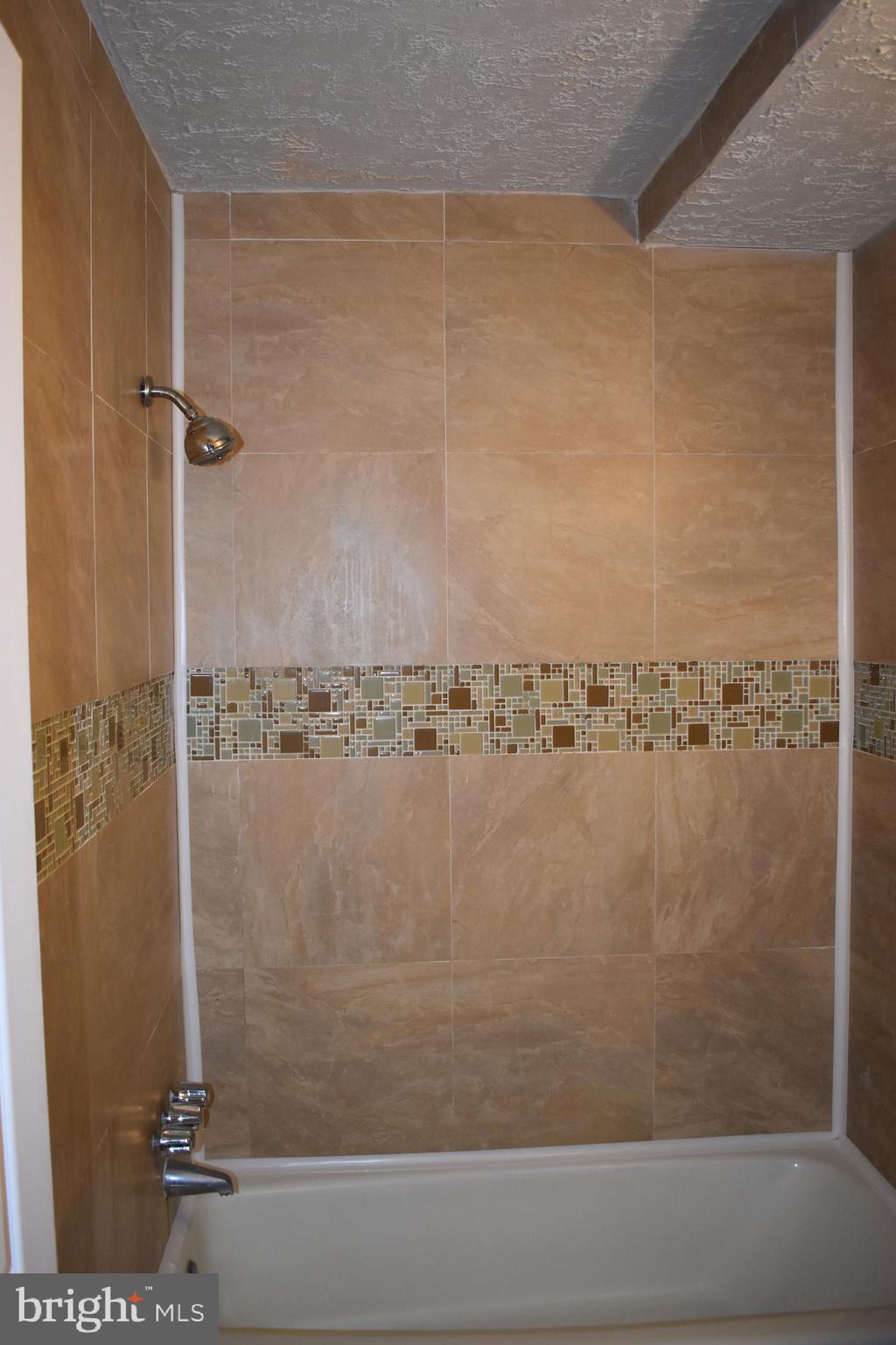 583 Summit Hall Road Gaithersburg, MD 20877 - Photo 29 of 52 Ceramic wrapping walls
