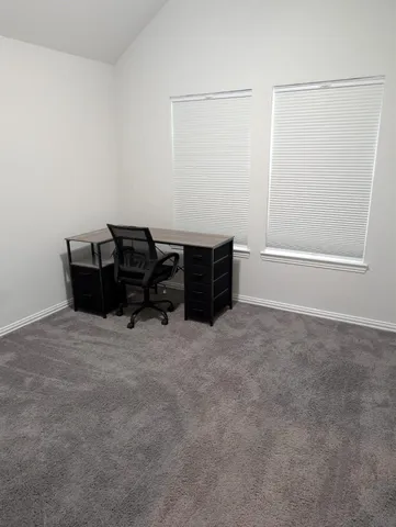 a bathroom with a sink a toilet a mirror and shower