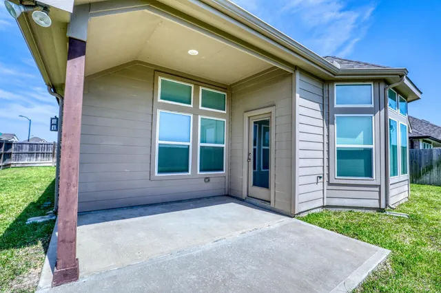 a big house with a big yard and large trees