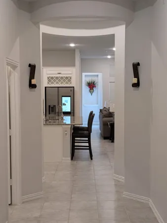 a living room with furniture and a gate