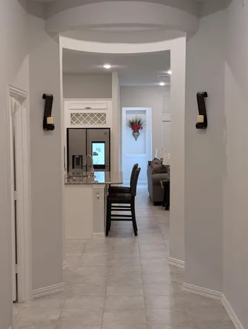 a living room with furniture and a gate