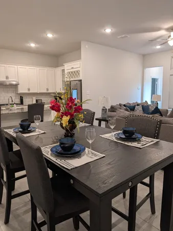 a kitchen with a table and chairs in it