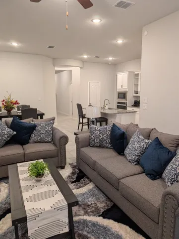 a living room with furniture and a couch