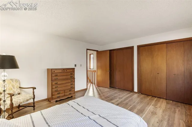 a bedroom with a bed and cabinets