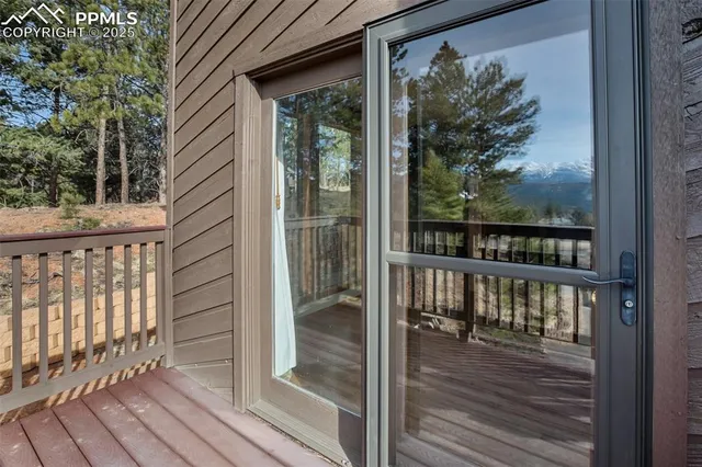 a view of a patio with wooden fence