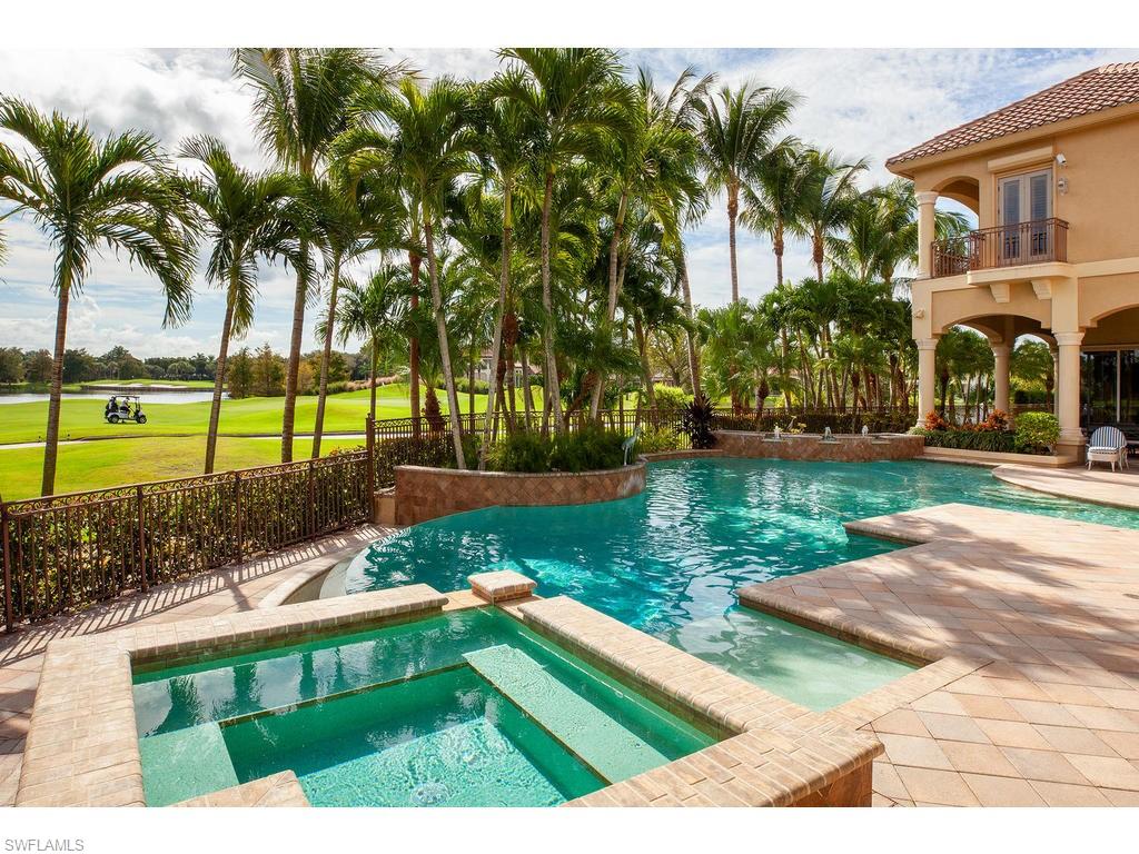 8631 Blue Flag Way Naples, FL 34109 - Photo 14 of 18 a view of a lake and a yard