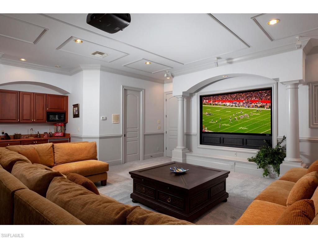 8631 Blue Flag Way Naples, FL 34109 - Photo 5 of 18 a living room with furniture and a flat screen tv