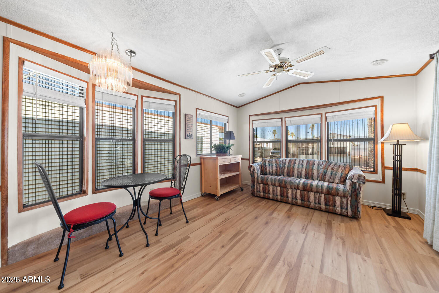 17200 West Bell Road, Unit 652 Surprise, AZ 85374 - Photo 12 of 19 a living room with furniture and a wooden floor