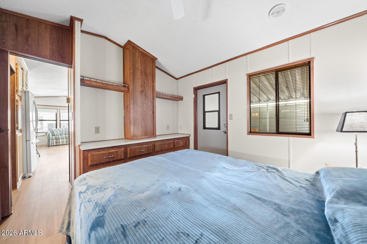 17200 West Bell Road, Unit 652 Surprise, AZ 85374 - Photo 15 of 19 a bedroom with a large bed and a window