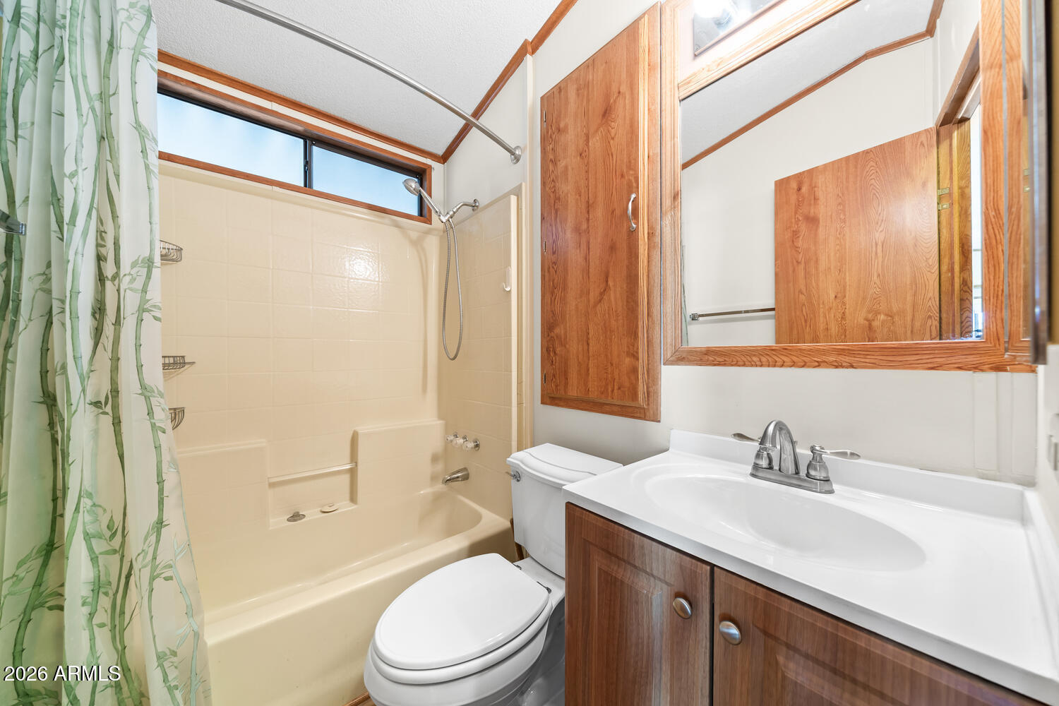 17200 West Bell Road, Unit 652 Surprise, AZ 85374 - Photo 5 of 19 a bathroom with a sink a toilet a mirror and shower