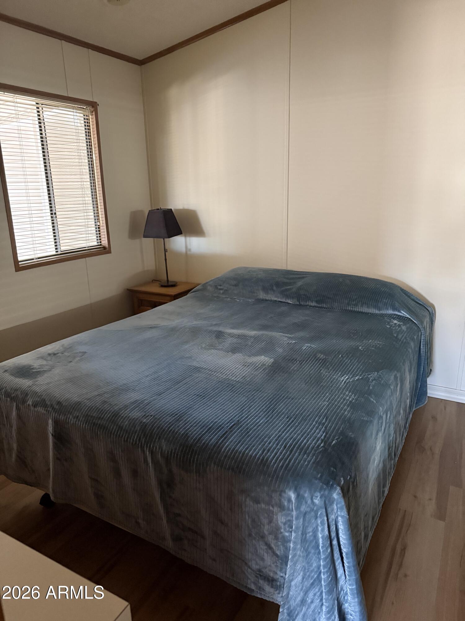 17200 West Bell Road, Unit 652 Surprise, AZ 85374 - Photo 5 of 5 a bedroom with a bed and window