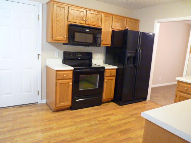 5538 Hunters Point Pike Lebanon, TN 37087 - Photo 4 of 20 a kitchen with stainless steel appliances granite countertop a refrigerator stove and microwave