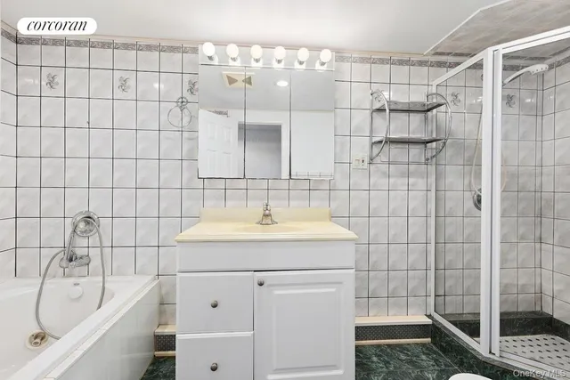 a bathroom with a sink shower and a bathtub