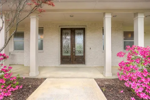 a front view of a house with a porch