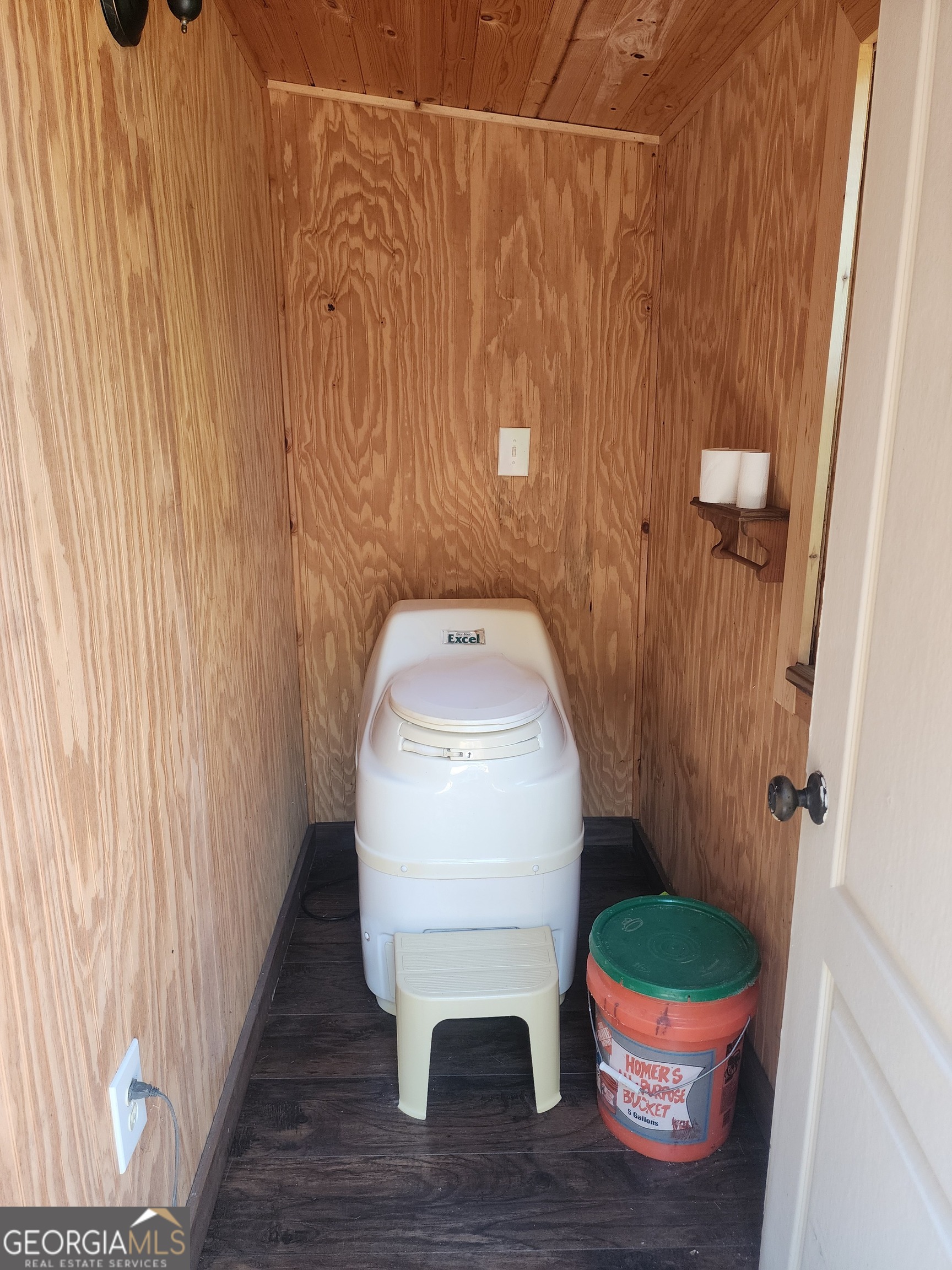 568 Yonah Lake Road Toccoa, GA 30577 - Photo 16 of 21 a white toilet sitting next to a wooden cabinet