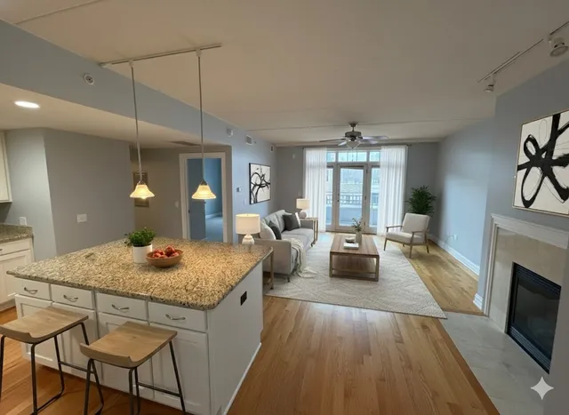 a bedroom with a bed and large windows