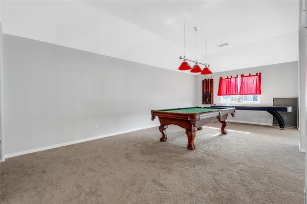 a living room with hard wood floors and a window