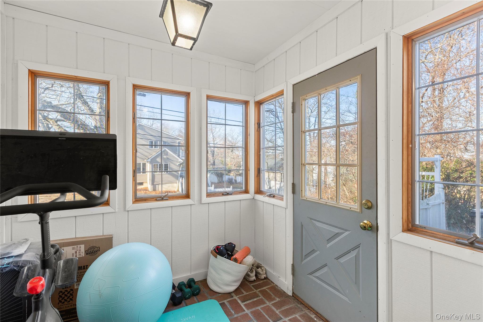 1 Tarn Road Rocky Point, NY 11778 - Photo 11 of 25 a living room with furniture and a flat screen tv