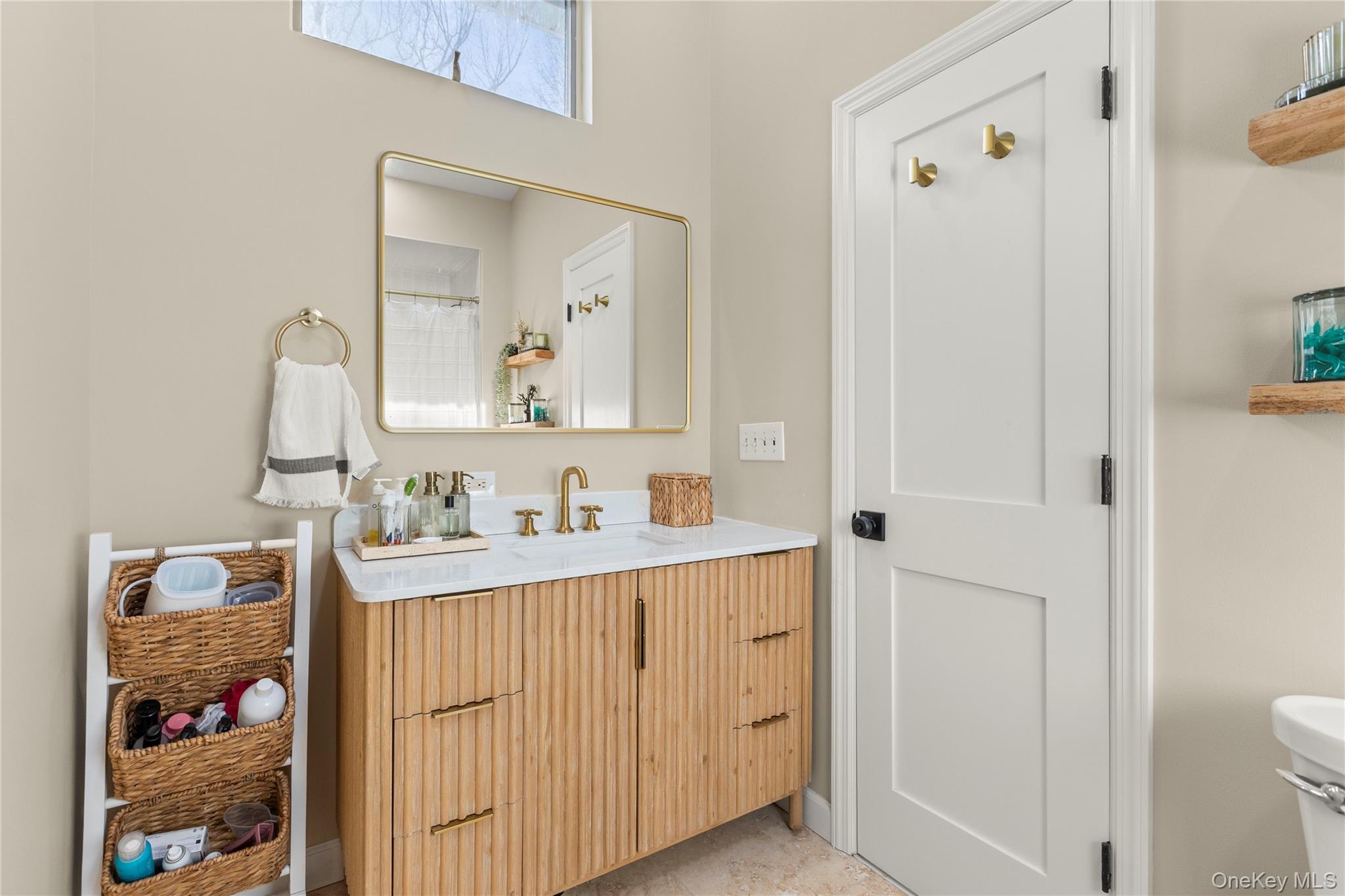 1 Tarn Road Rocky Point, NY 11778 - Photo 15 of 25 a bathroom with a sink a toilet and a mirror