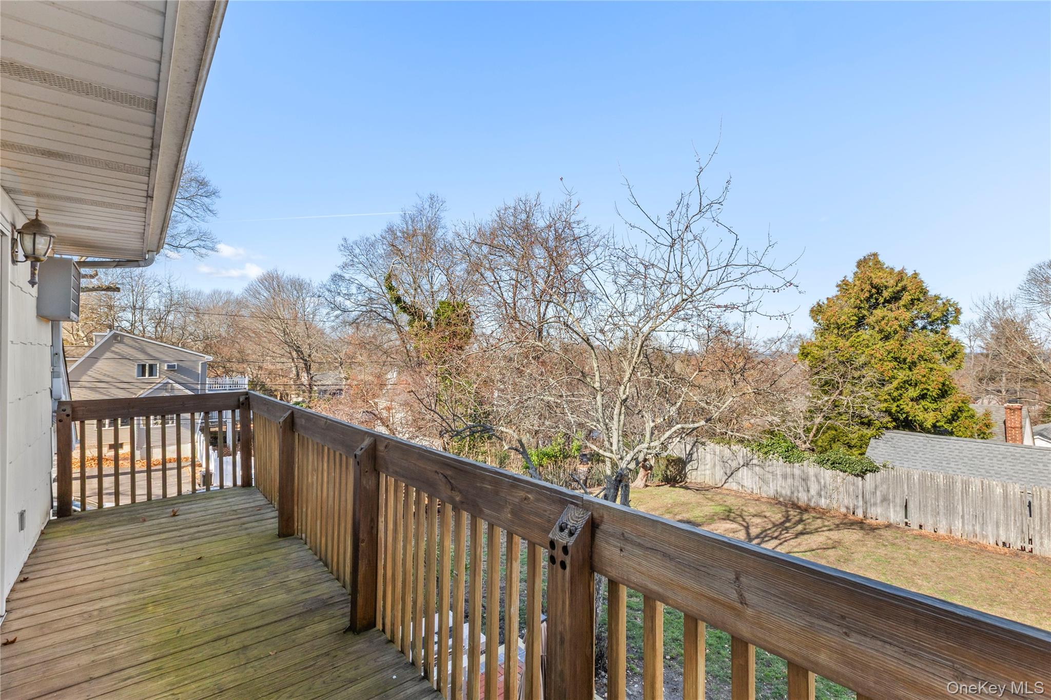 1 Tarn Road Rocky Point, NY 11778 - Photo 16 of 25 a balcony with wooden floor and fence