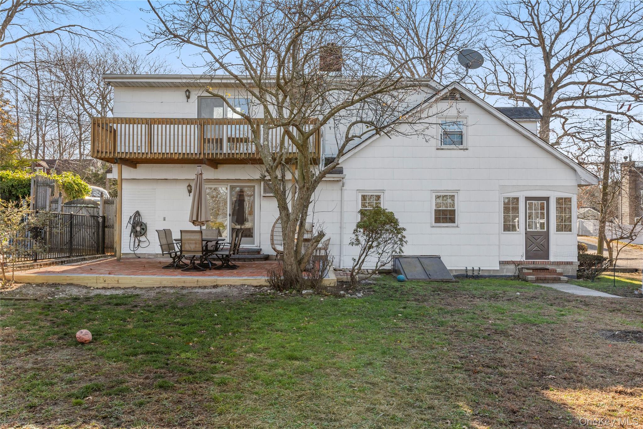 1 Tarn Road Rocky Point, NY 11778 - Photo 21 of 25 a view of a house with backyard and a tree