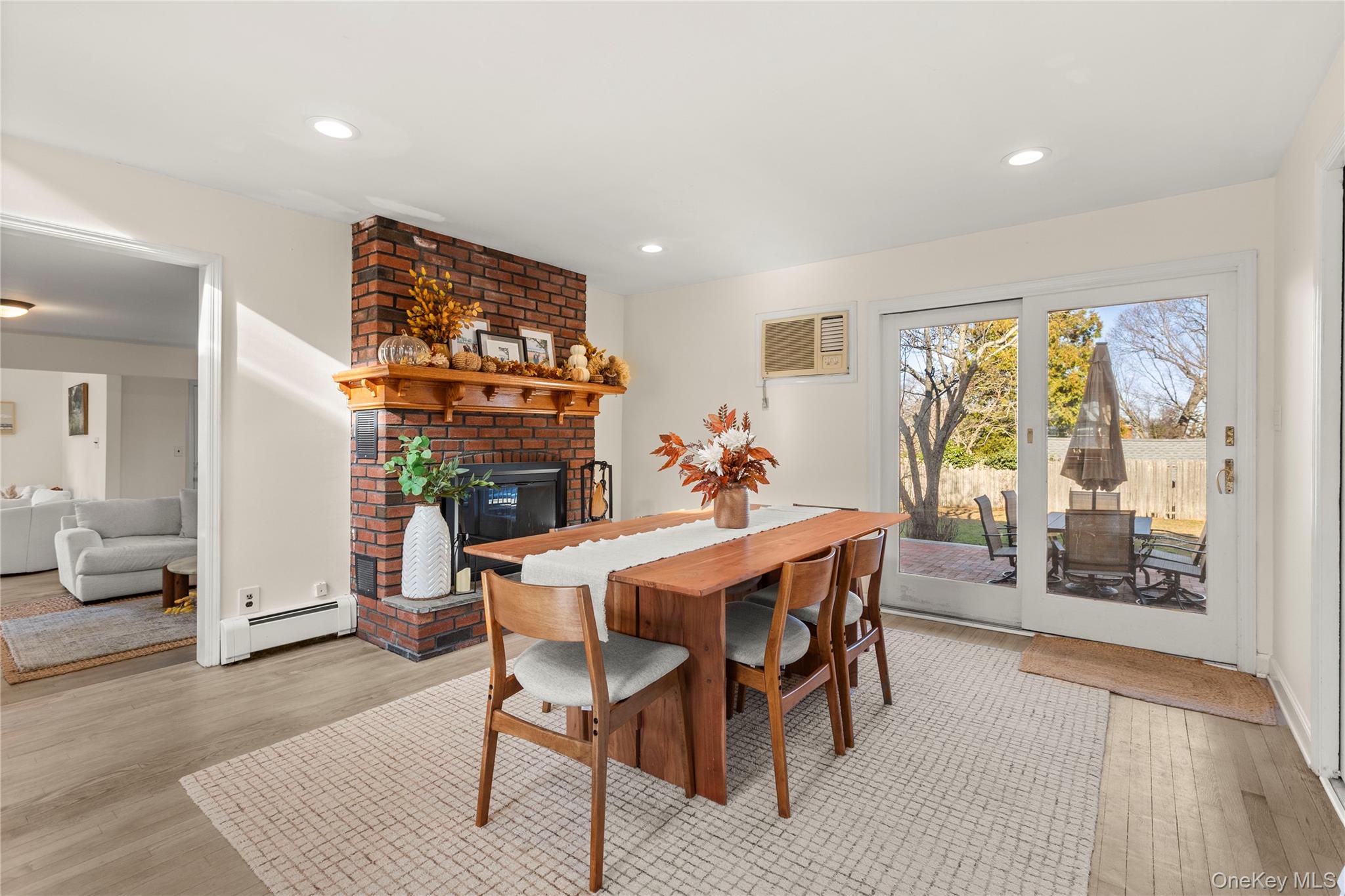 1 Tarn Road Rocky Point, NY 11778 - Photo 4 of 25 a view of a dining room with furniture and wooden floor