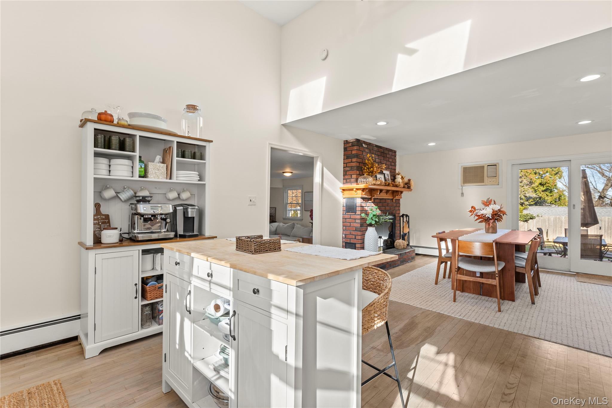 1 Tarn Road Rocky Point, NY 11778 - Photo 7 of 25 a view of a dining room with furniture and wooden floor