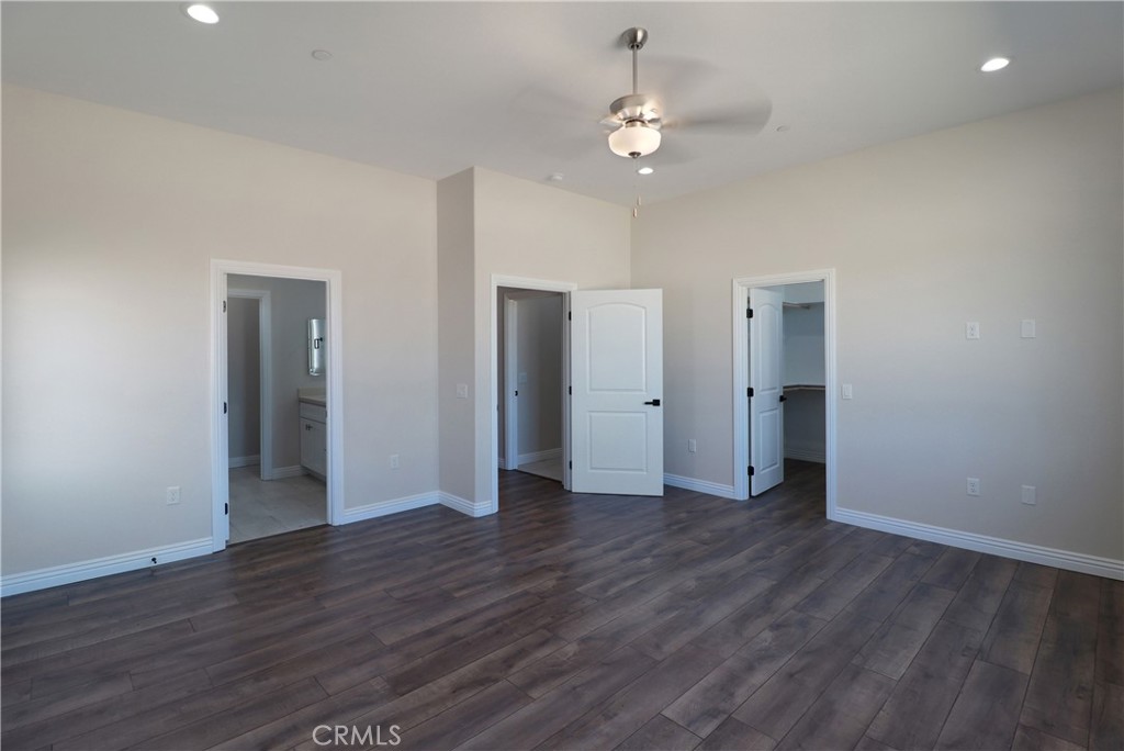 14785 Tigertail Road Apple Valley, CA 92307 - Photo 9 of 20 a view of an empty room with wooden floor