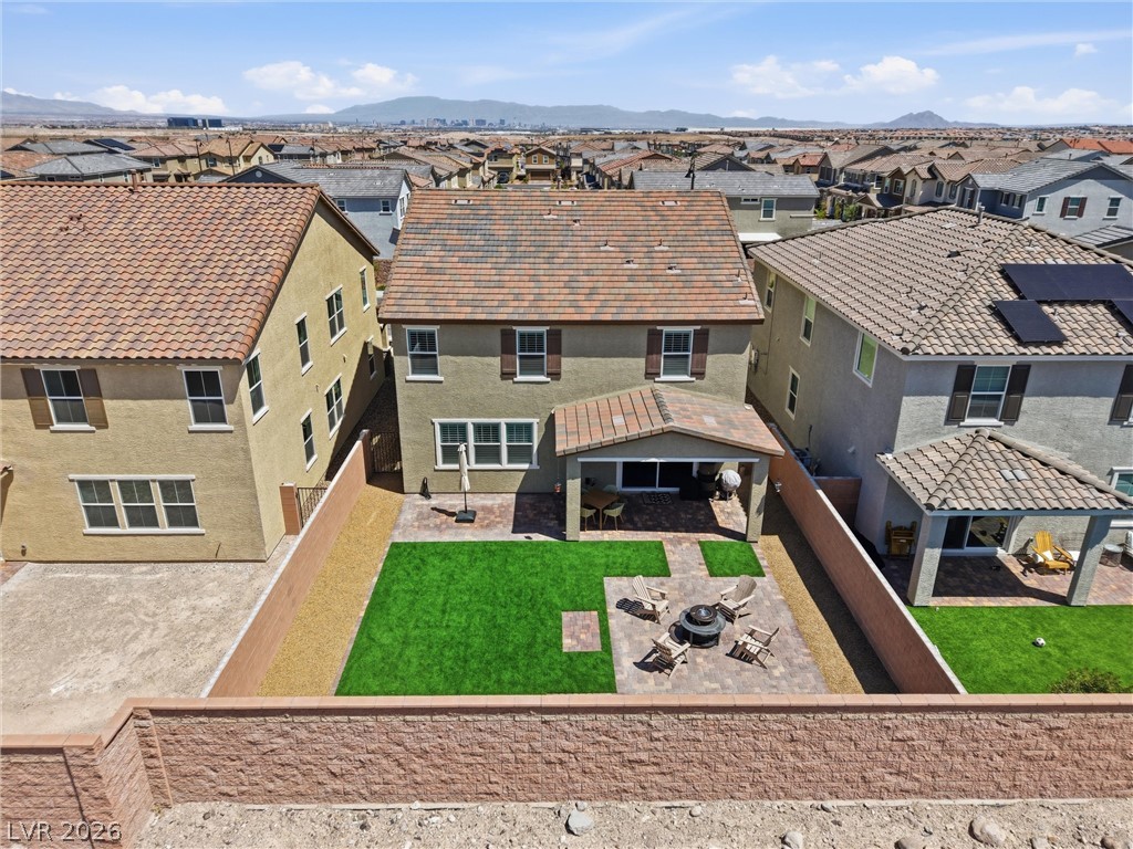 3705 Alla Rocca Avenue Henderson, NV 89044 - Photo 38 of 50 An aerial view captures the home's inviting backyard with a charming patio and lush lawn.