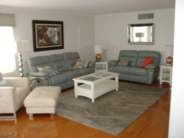 a living room with furniture and a rug
