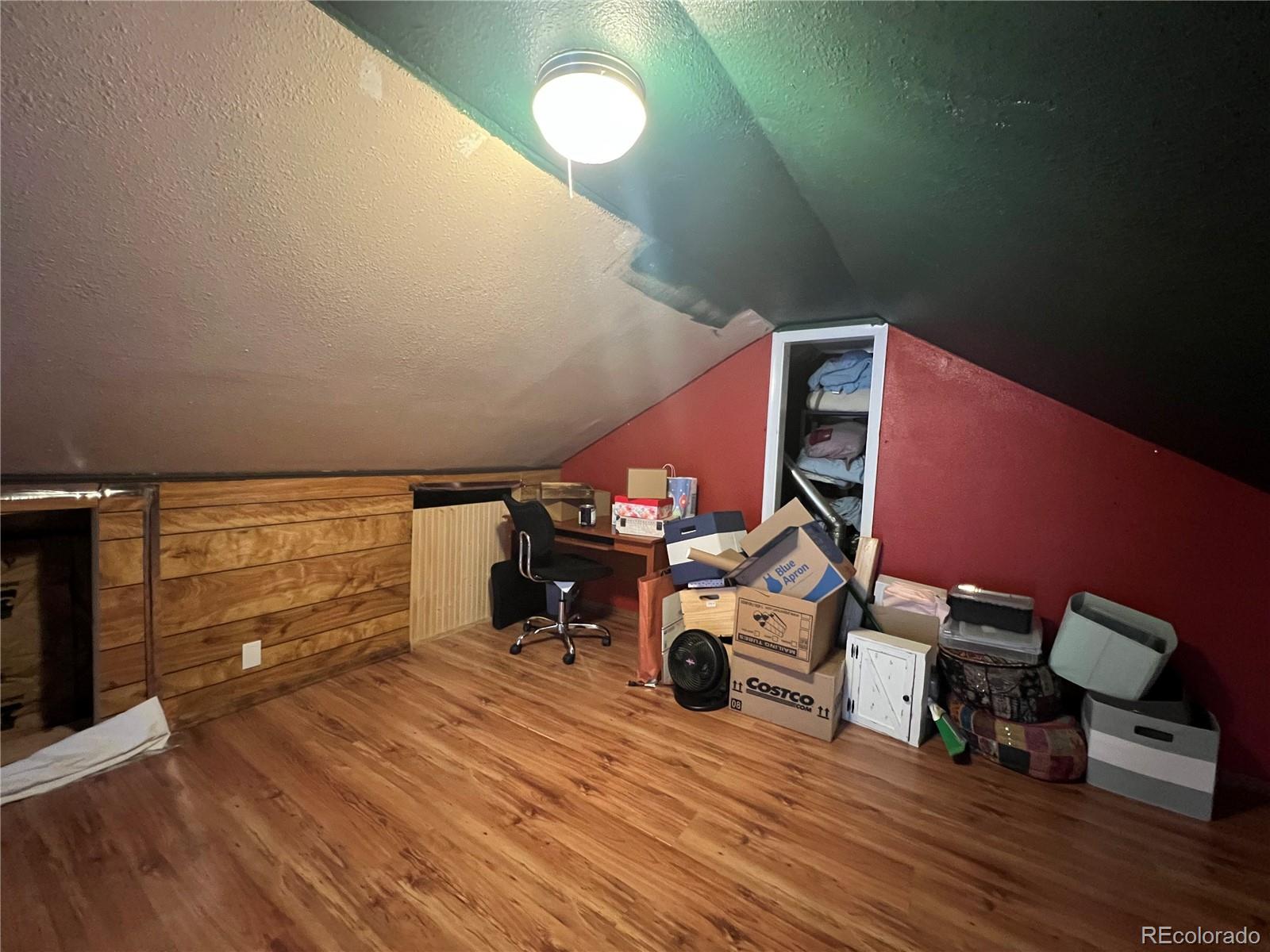 187 Johnson Road Bailey, CO 80421 - Photo 17 of 37 a view of a room with wooden floor
