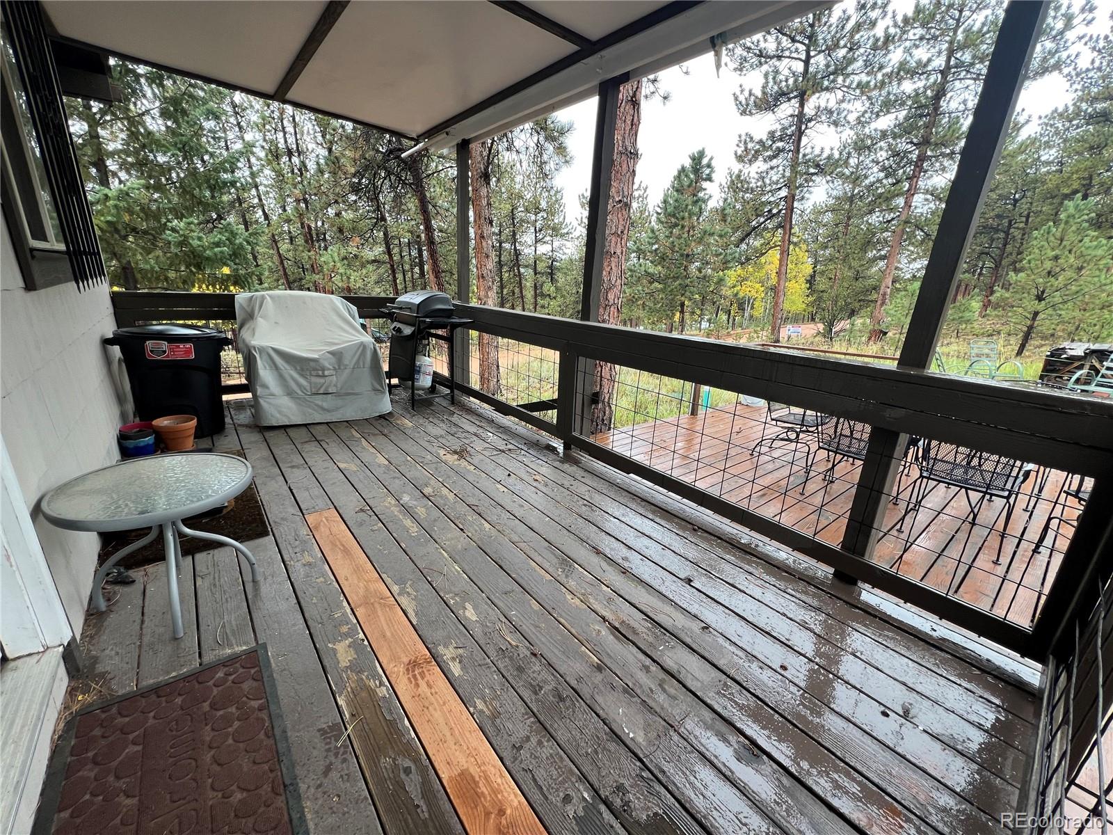 187 Johnson Road Bailey, CO 80421 - Photo 21 of 37 a view of balcony with furniture