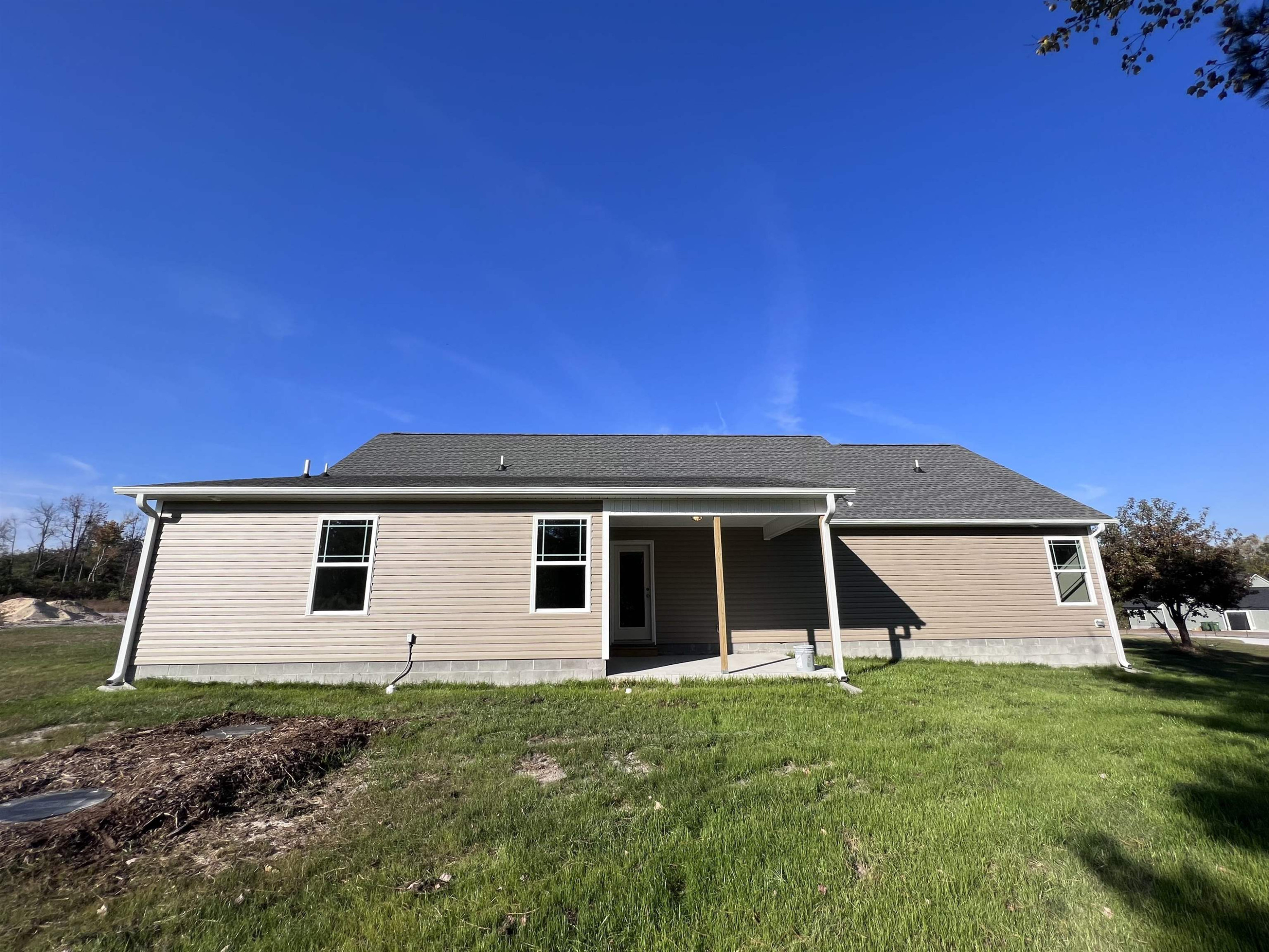 346 Touchdown Way Benson, NC 27504 - Photo 16 of 16 a view of a house with a yard