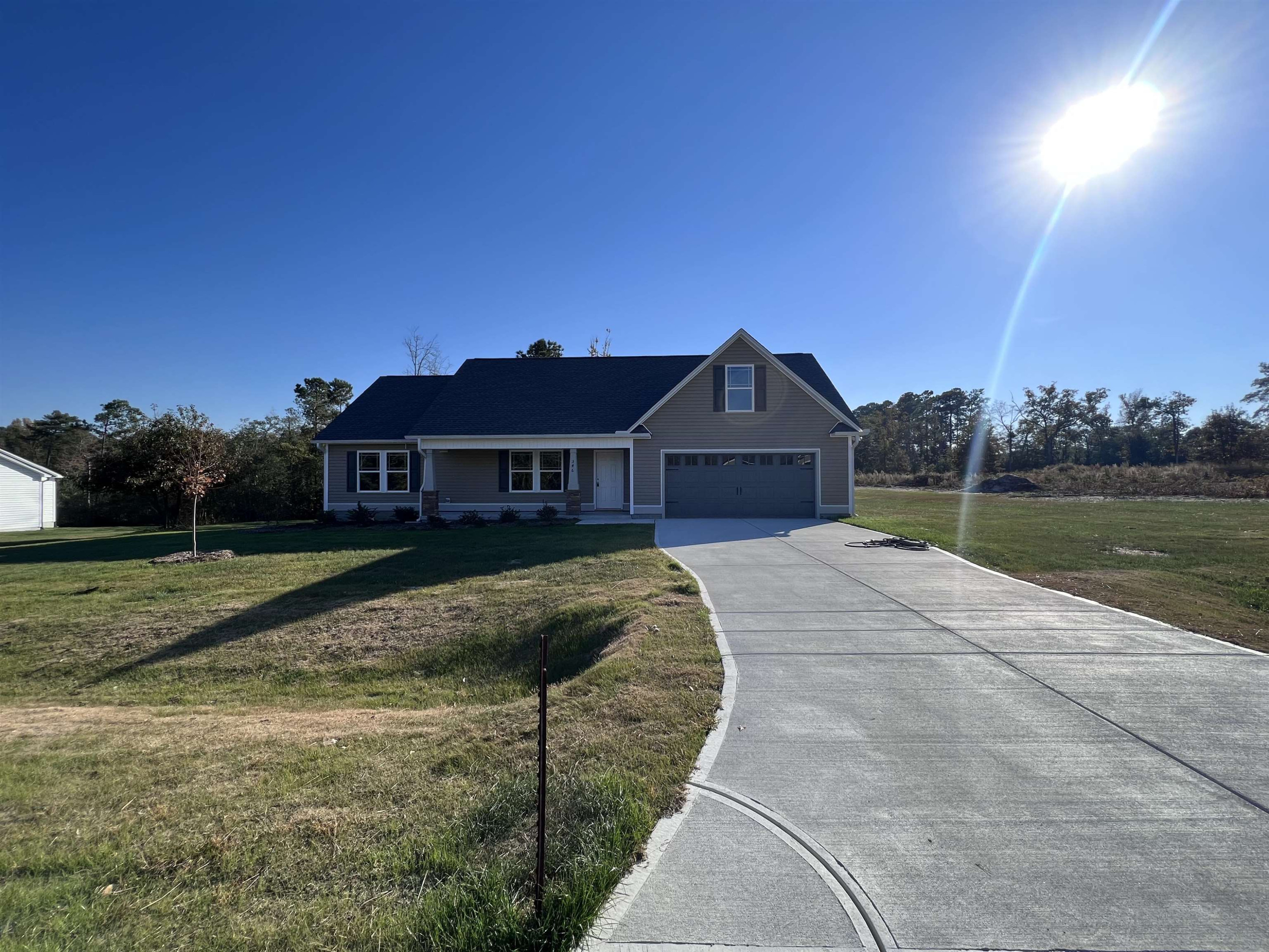 346 Touchdown Way Benson, NC 27504 - Photo 2 of 16 a front view of a house with a yard