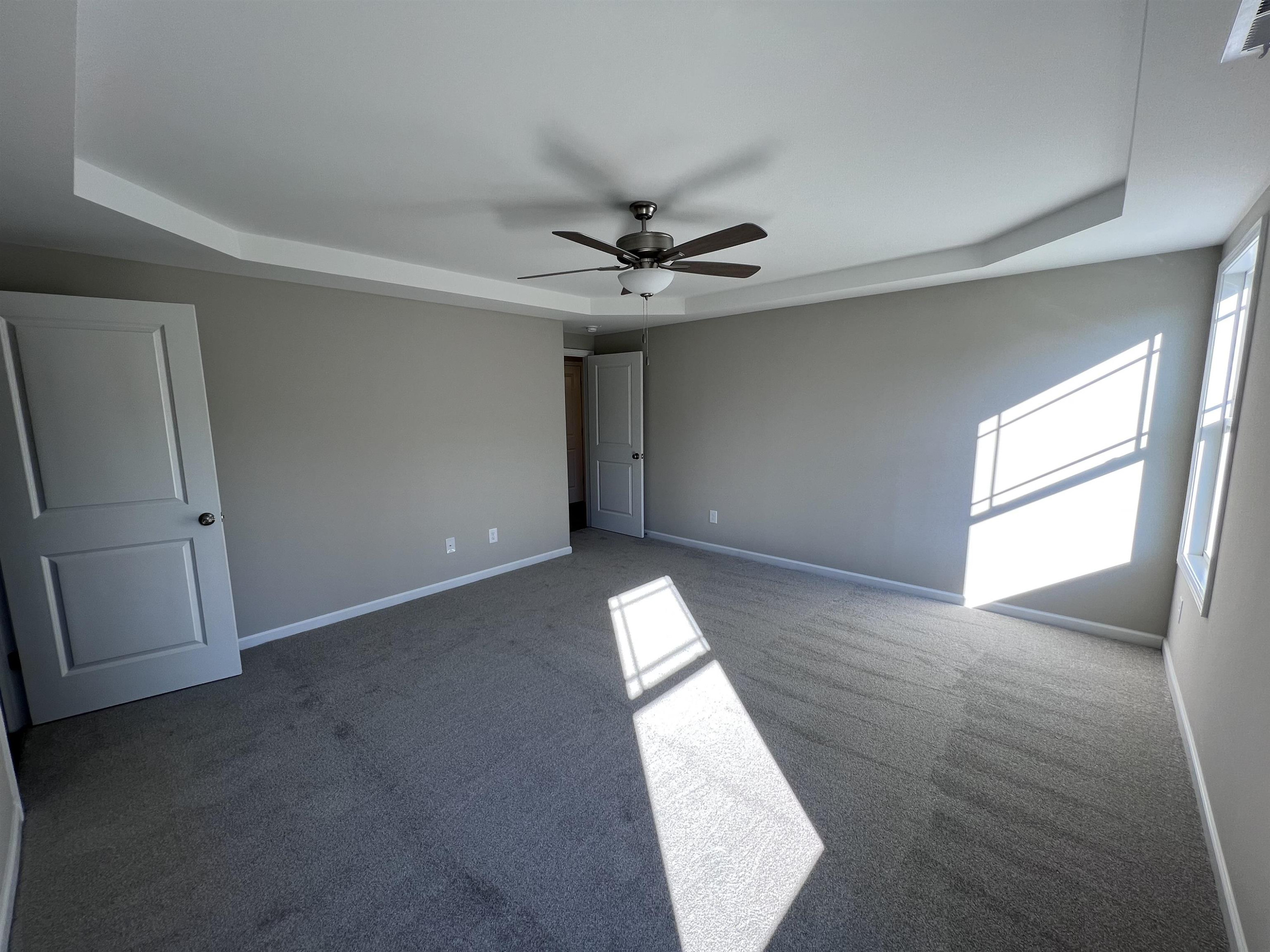 346 Touchdown Way Benson, NC 27504 - Photo 7 of 16 wooden floor in an empty room with a window