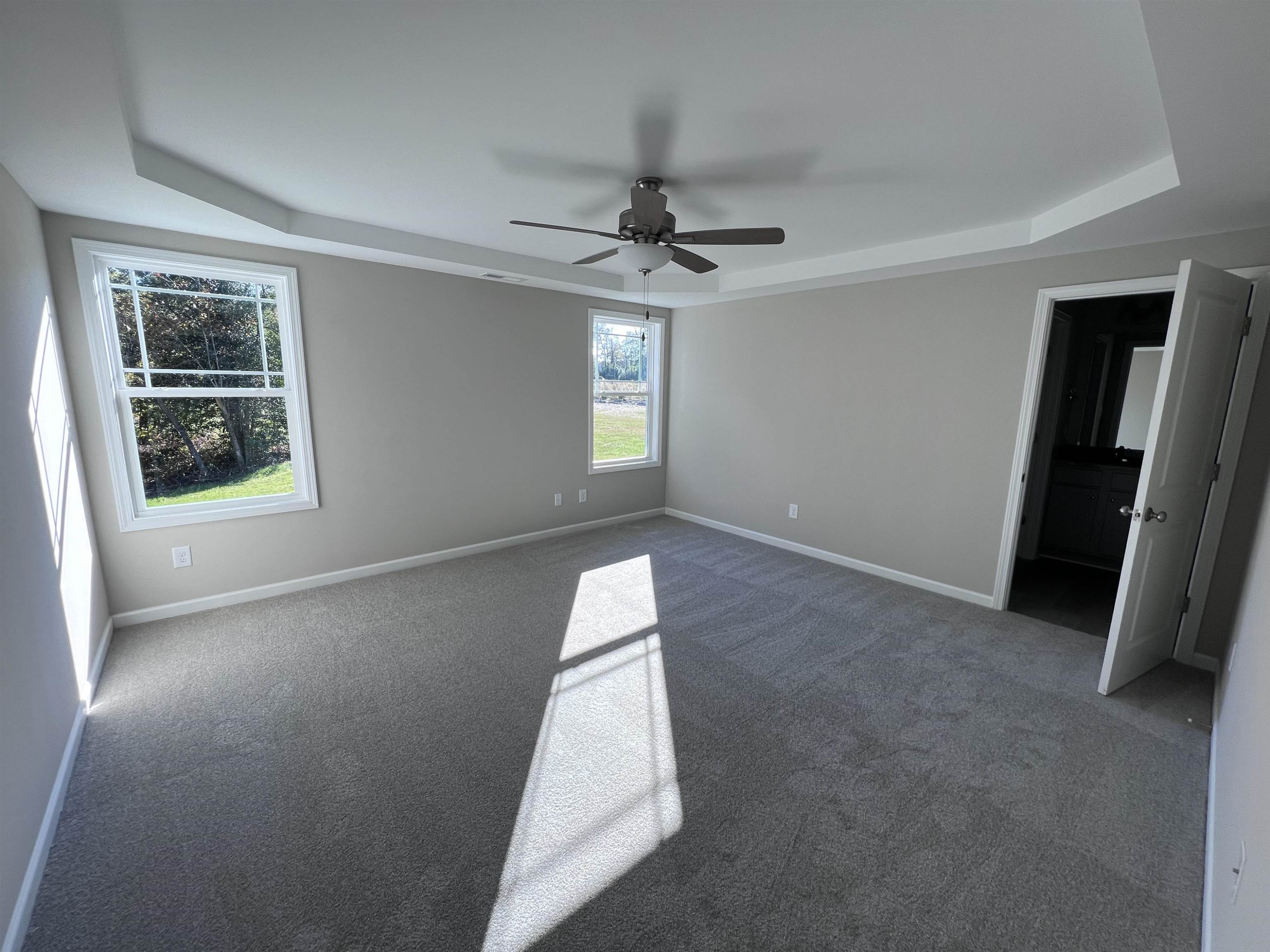 346 Touchdown Way Benson, NC 27504 - Photo 8 of 16 an empty room with windows and cabinet