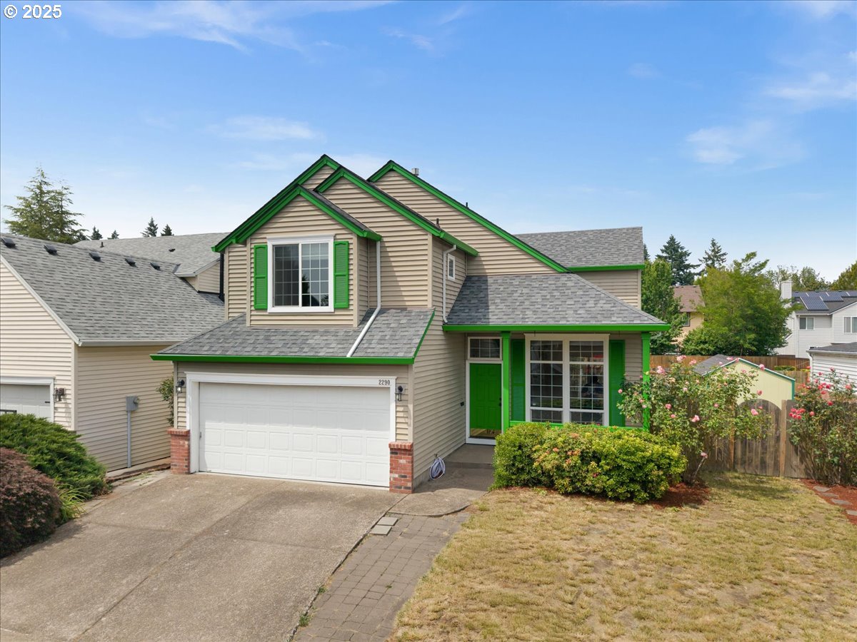 a front view of a house with a garden