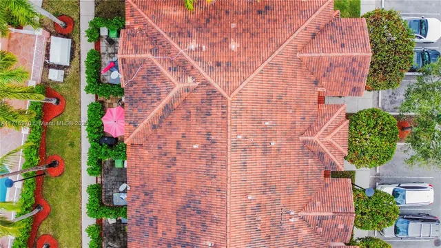 an aerial view of lake and residential houses with outdoor space