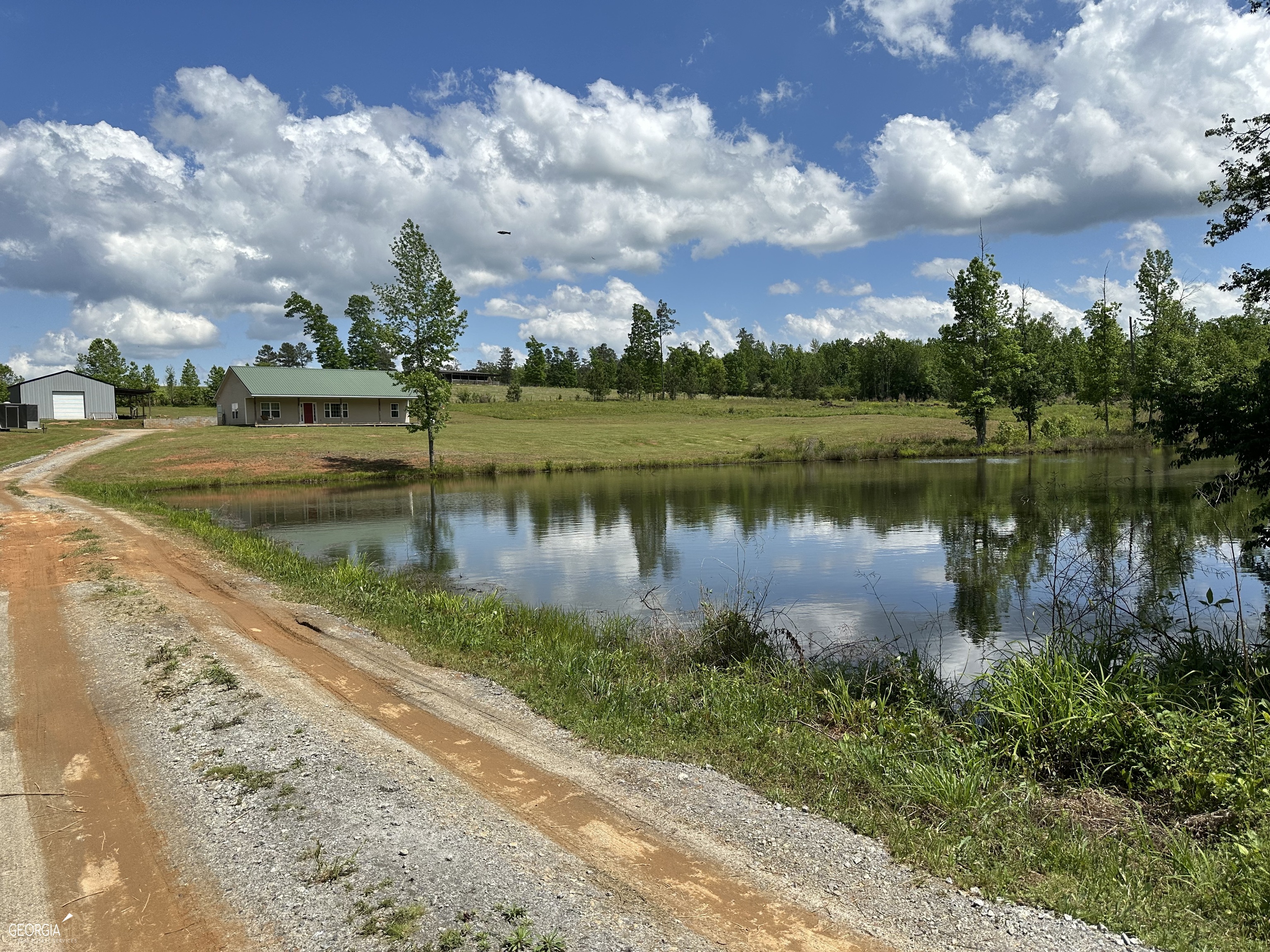 a view of a lake with houses in the back